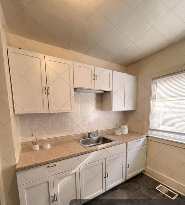 Building Photo - Cozy and Bright 2-Bedroom Duplex with Fire...