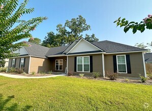 Building Photo - Charming 4-Bedroom Home with Fenced Yard &...