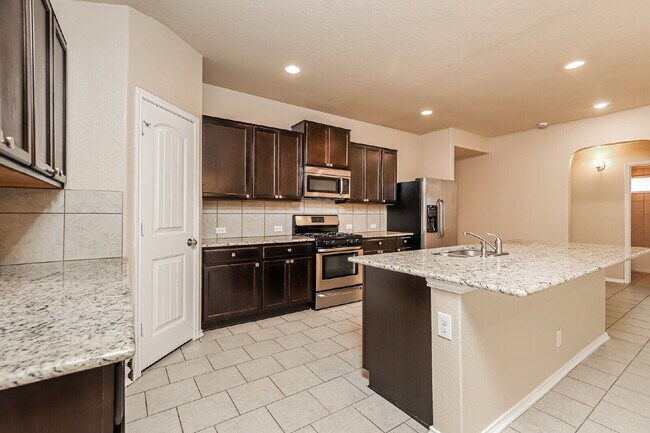 Building Photo - "Charming 4-Bed Sanctuary on Live Oak Pass with Modern Granite Finishes!"