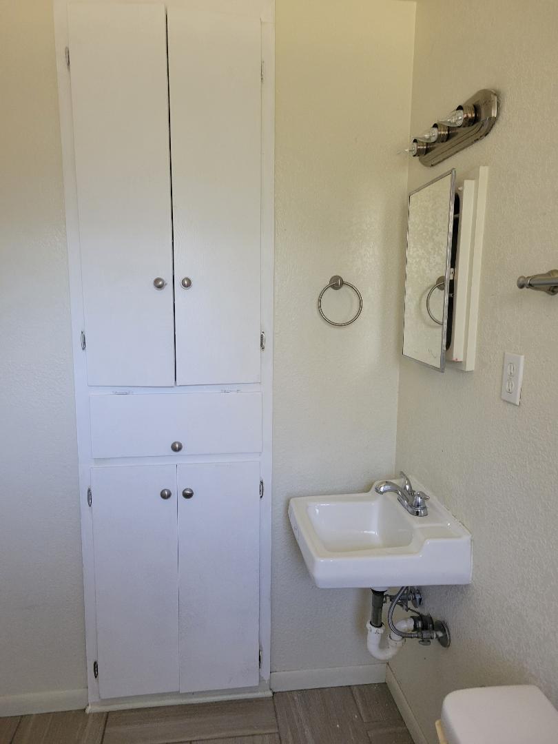 Bathroom sink - 1607 N W S Young Dr