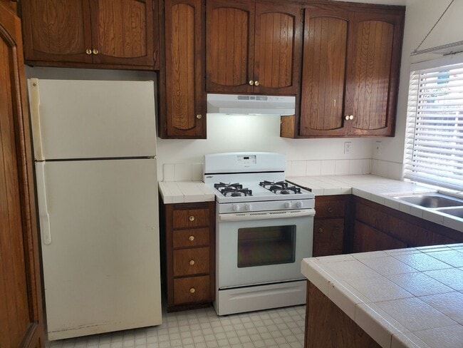 Building Photo - Corner lot detached SFR with a fenced yard in a wonderful neighborhood available 12/20/2025.