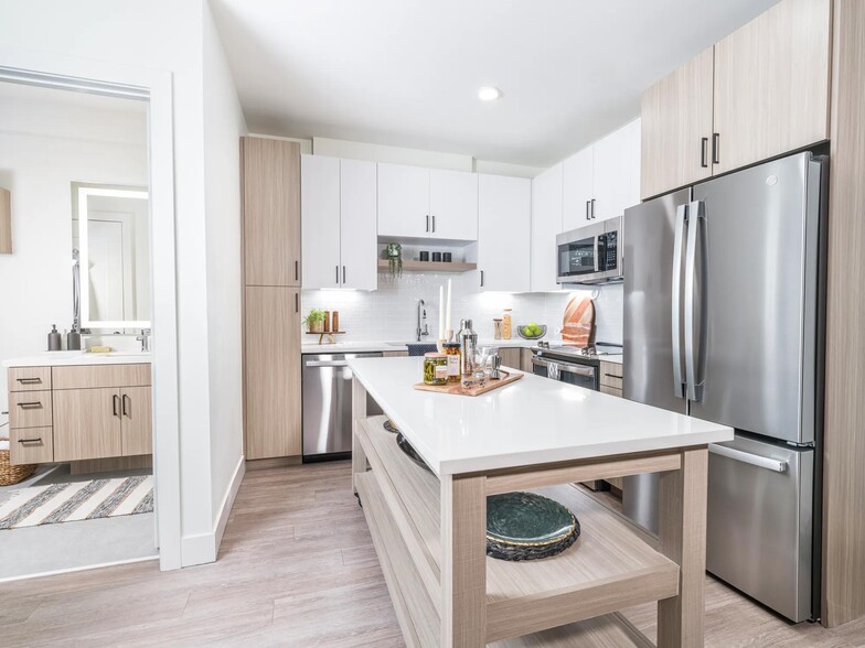 Creating culinary magic with a chef's dream island complete with ample storage, found in the heart of Modera Golden Triangle, Denver, Colorado. - Modera Golden Triangle