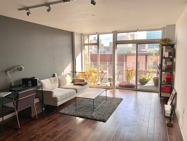 Bright living room and large balcony - 630 Thomas L Berkley Way