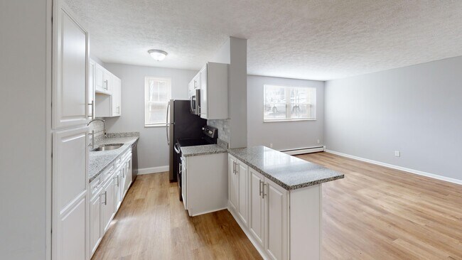 Bright Open Kitchen and Living Area - The Courtyard of Oakley