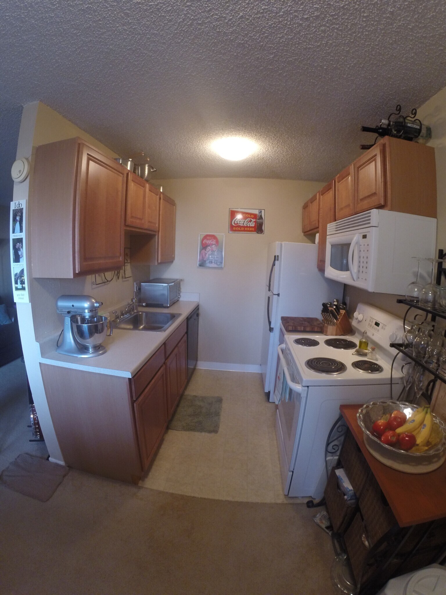 Kitchen with microwave, dishwasher, refrigerator and range - 3393 Madison Ave