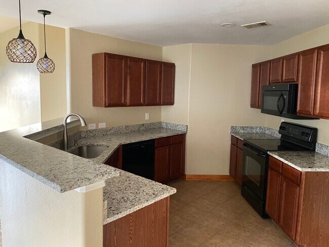 Kitchen with Granite Countertops and Serving Bar - 513 Paddle Dr