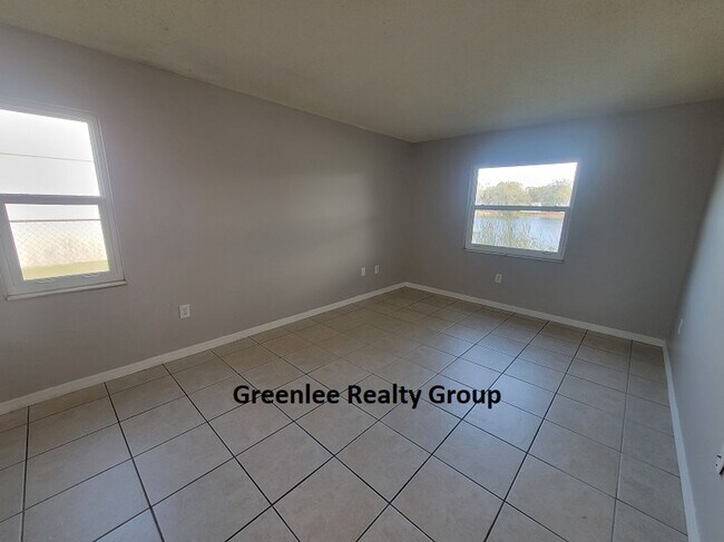 Building Photo - Relax by the water in this spacious 2-bedroom home with a 2-car garage, nestled in the highly des...