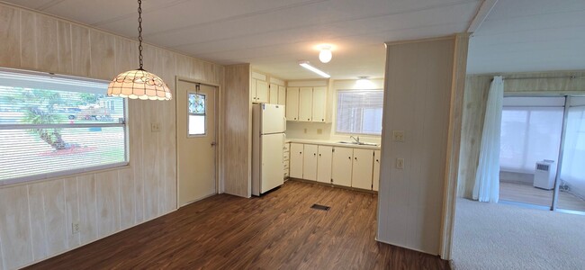 Building Photo - 2 bed 2 baths with carport