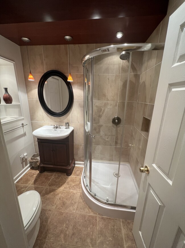 Bathroom with closet, shower only, and vanity. - 3617 Sunset Rdg