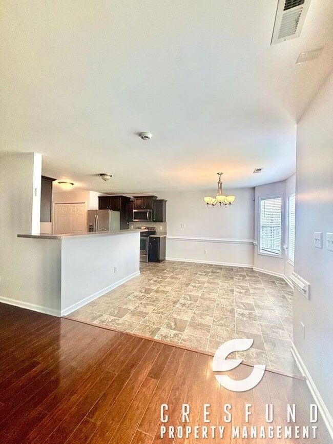 Building Photo - Freshly Painted and Spacious 4 Bedroom, 3 ...