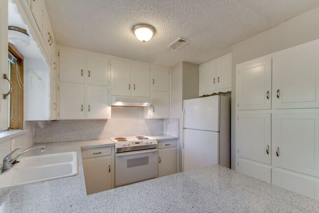 Building Photo - No Carpet! Great tree shaded yard!