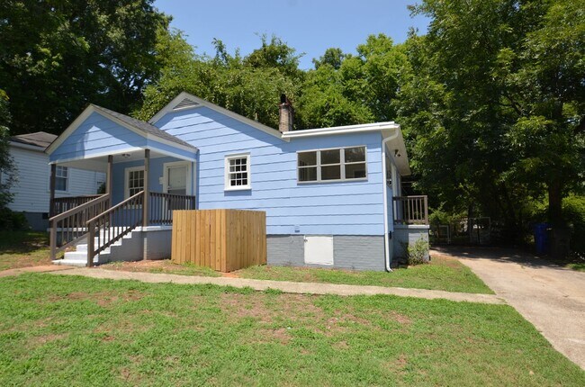 Building Photo - Charming 2-Bedroom, 2-Bath Single-Family Home with Sunroom & Wooded Views