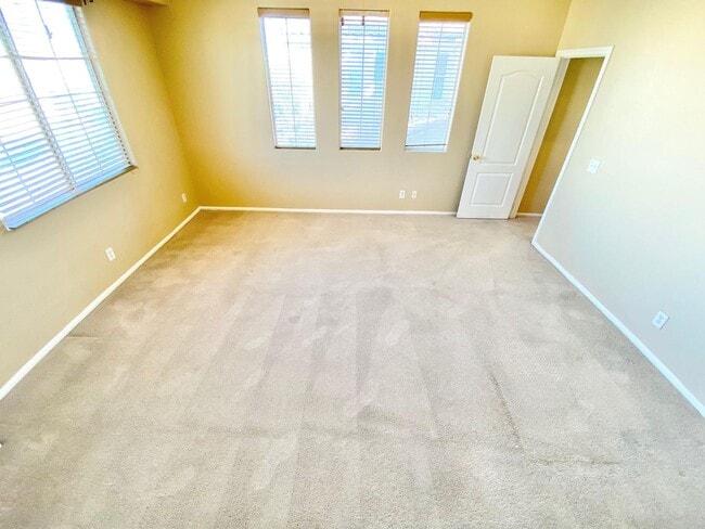 Building Photo - THIS SPACIOUS RESIDENCE FEATURES 4 BEDROOM...