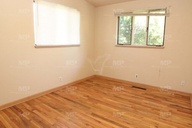 Building Photo - Three Bedroom with Covered Parking Spot!