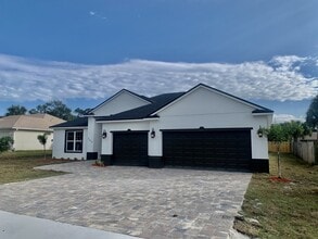 Building Photo - "Spacious 4-Bedroom 3-Bath with In-Law Suite & Granite Finishes in Palm Bay!"