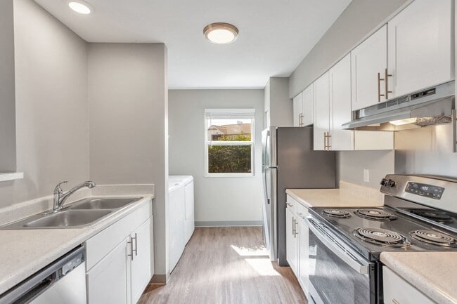 Experience open-concept living with seamless flow between the kitchen and living areas, professionally managed by Highlands Vista Group. - Arbor Crossings