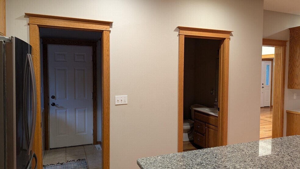 Kitchen (looking towards laundry/garage access and 1/2 bathroom) - 2669 Kathleen Ln NE