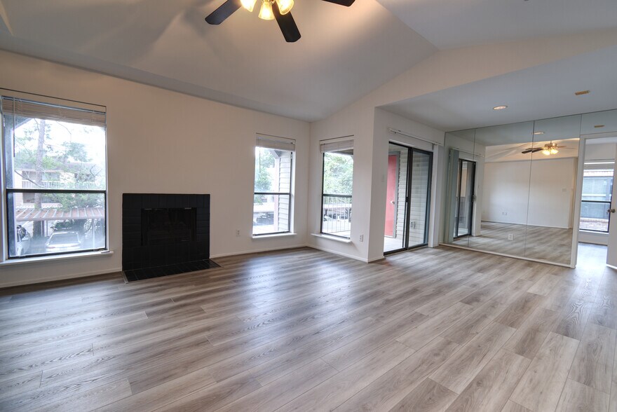 Living Room/Dining Room combo area seen from the Secondary bedroom's access. - 2025 Augusta Dr
