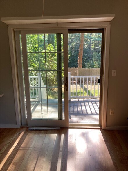 living area view to rear deck - 32 Adams St