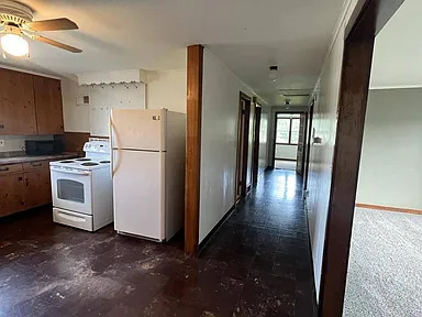 Hallway (old photo of kitchen): natural light and hallway leading to other rooms - 1071 Van Velsen St