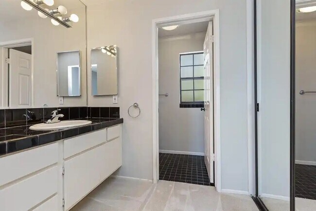 Building Photo - Upgraded La Costa Townhome