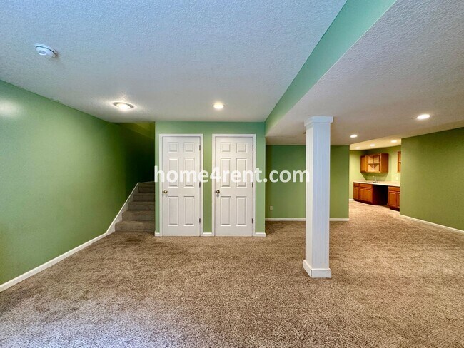 Building Photo - Beautiful Four-Bedroom Home with Three Car Garage, Wood Floors, Finished Basement and a Fenced Ya...