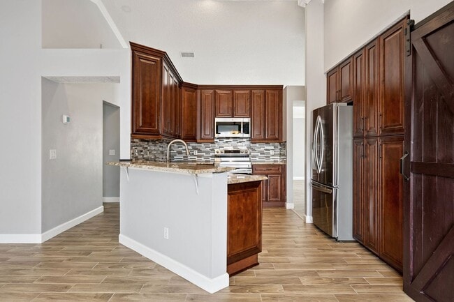 Building Photo - Fully renovated and updated 3/2/2 home with HUGE fenced yard in East Orlando