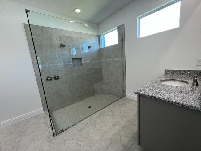 Building Photo - This Charming Brand-New Home is a 4/3 with...