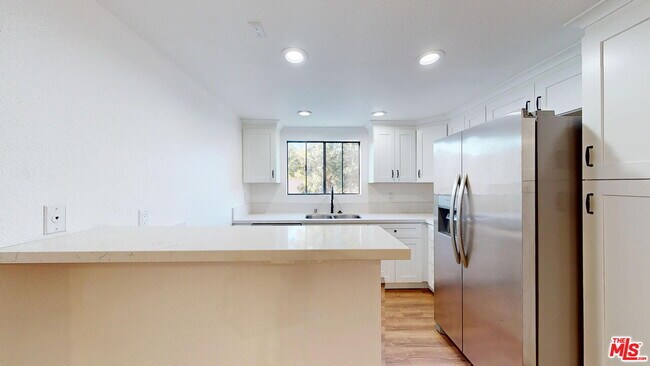 Building Photo - 10220 De Soto Ave
