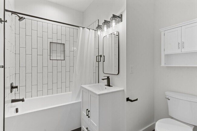 Building Photo - Brand new 2 bed/2 bath, central a/c, dishwasher, washer & dryer, deck & patio! March rent free!