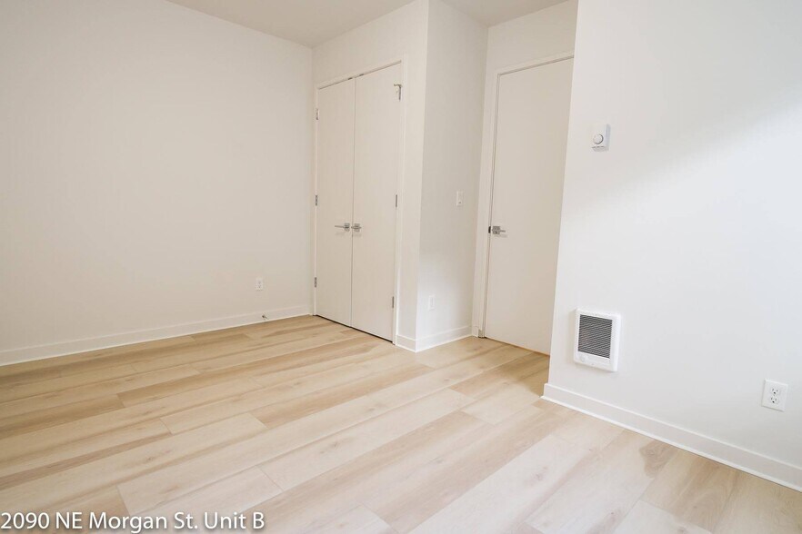Bedroom features closet, wall heaters and LVP flooring throughout - 2090 NE Morgan St