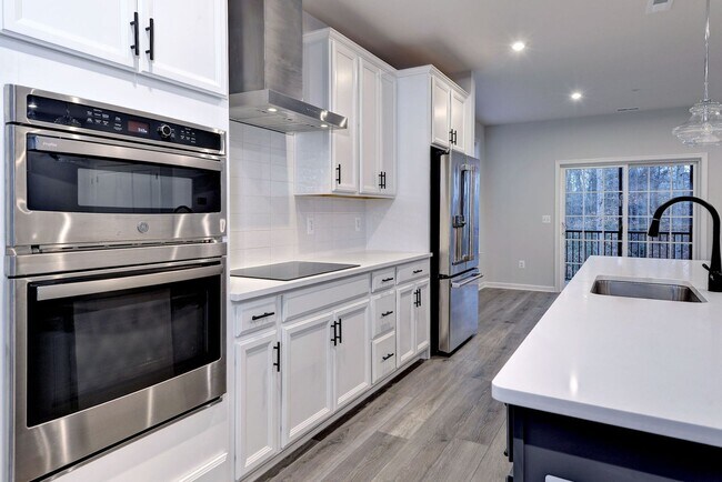 Building Photo - Three Story Brick End Unit with Rooftop Terrace