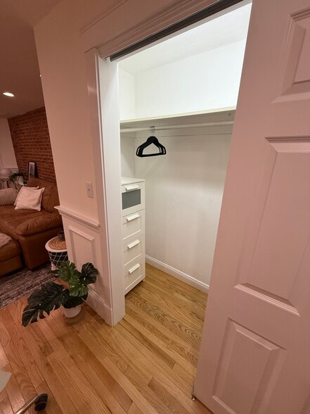 living space closet - with dresser and hangers - 382 Riverway St