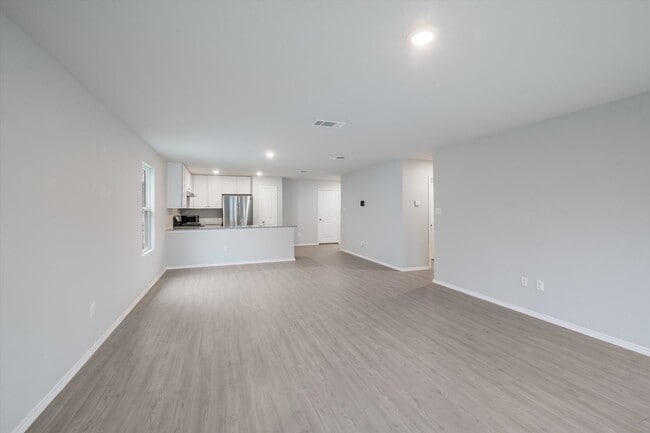 Building Photo - Open-Concept Living with New Flooring