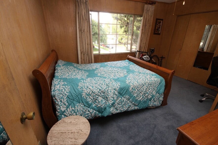 Paneled room, big bay window facing East - 11061 Missouri Ave