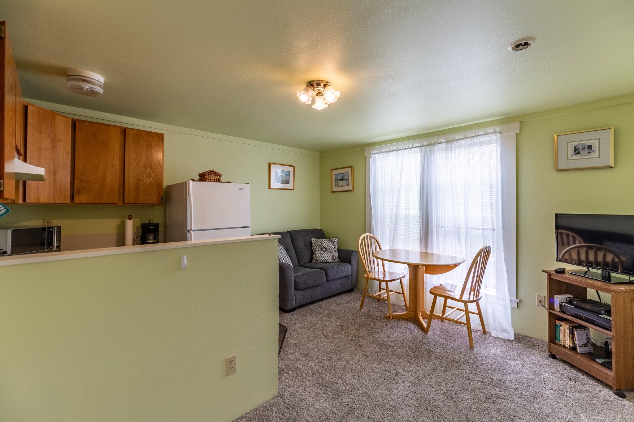 Table for two with a view of small-town life. Perfect for enjoying a meal or working in this laptop friendly location with wifi included in the monthly rent. - 703 Q Ave Apt 4