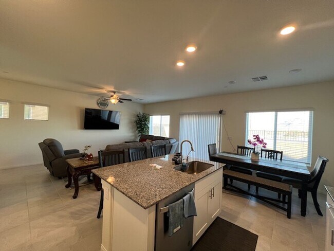 Building Photo - FULLY FURNISHED!!! beautiful 3 bedroom 2 and half bath home is located in the Symmetry Bay Cadenc...