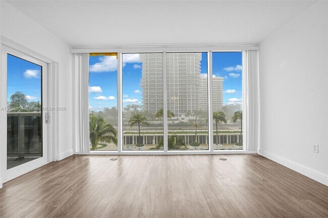 Building Photo - 10275 Collins Ave