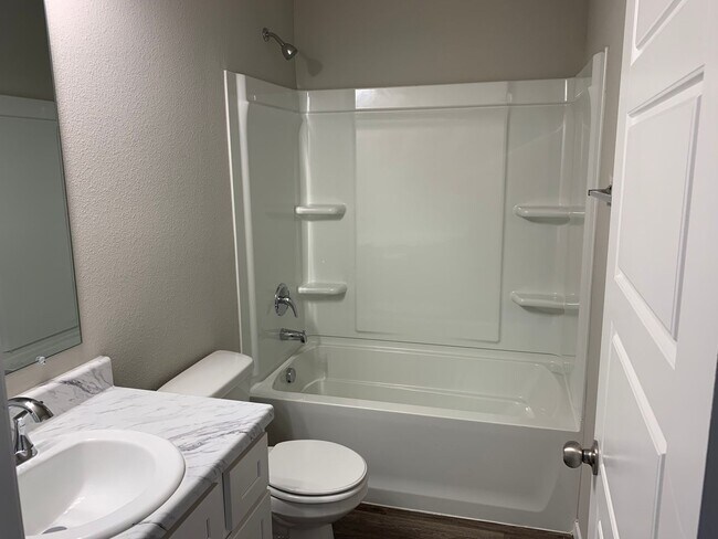 Building Photo - This well-designed 4-bedroom home has a split floor plan that gives the feeling of space.