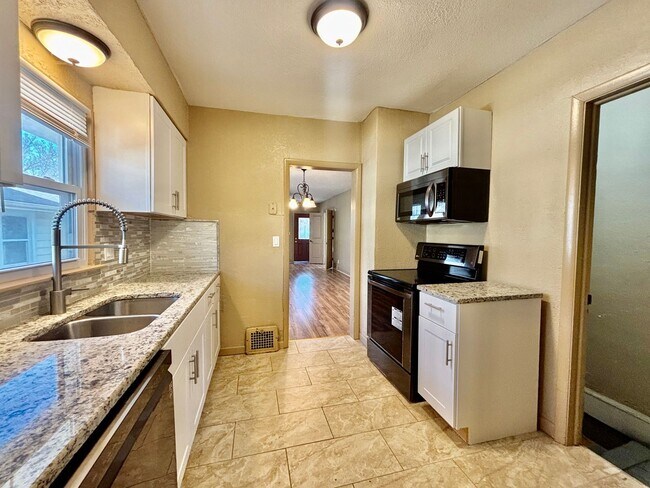 Building Photo - Spacious 2-Bedroom + Den Home with Ample Parking & Backyard!