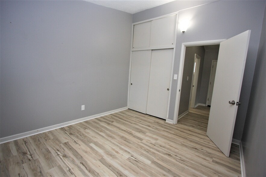 Large bedroom with huge closet (closet has storage up to top of ceiling). - 5442 -5448 SE Franklin St