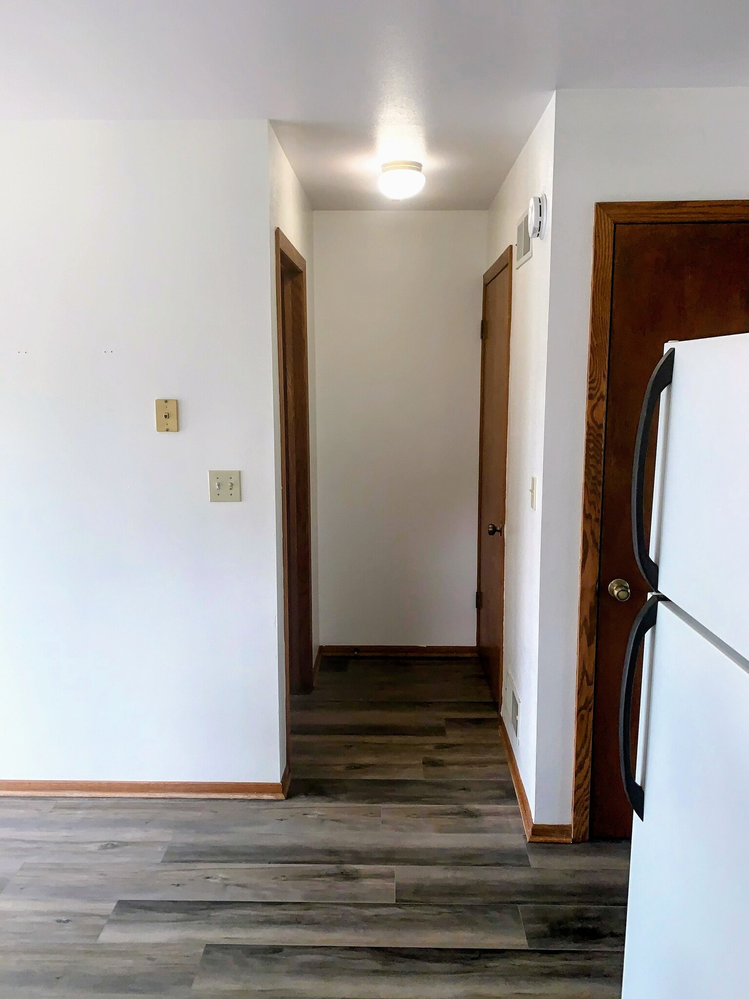 Kitchen Hall to half bath and basement - 6169 S Barland Ave