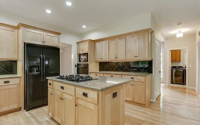 Building Photo - Spacious Four-Bedroom Home with Gourmet Kitchen, Multiple Living Areas, Loft, and Beautifully Lan...