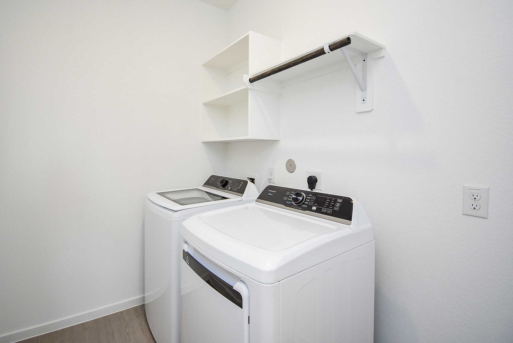 laundry room with storage and hanging rack - 6714 Iron Clover Dr