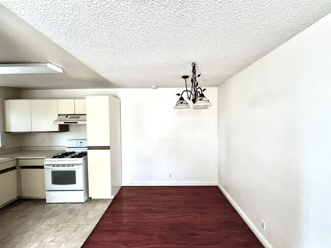 Building Photo - 2 Bedroom, 2 Bath Upstairs Condo with Private Balcony & 2-Car Garage, Gated Community, Water/Tras...