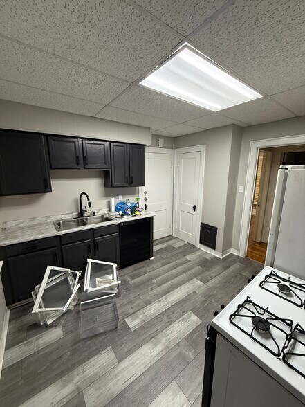 Kitchen with new dishwasher/ back door and closet area with a laundry shoot to basement - 3616 E 106th St