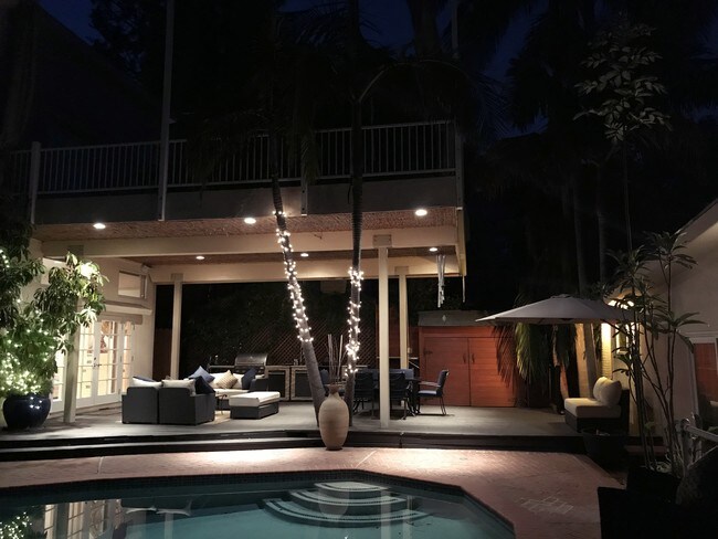 Evening view of Guesthouse, Pool & Deck area - 8567 Walnut Dr