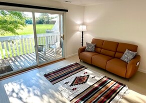 Leather reclining sofa, USB/C outlets in armrests. Center back folds fwd w cup holders/charger. - 174 Hemingway Ct