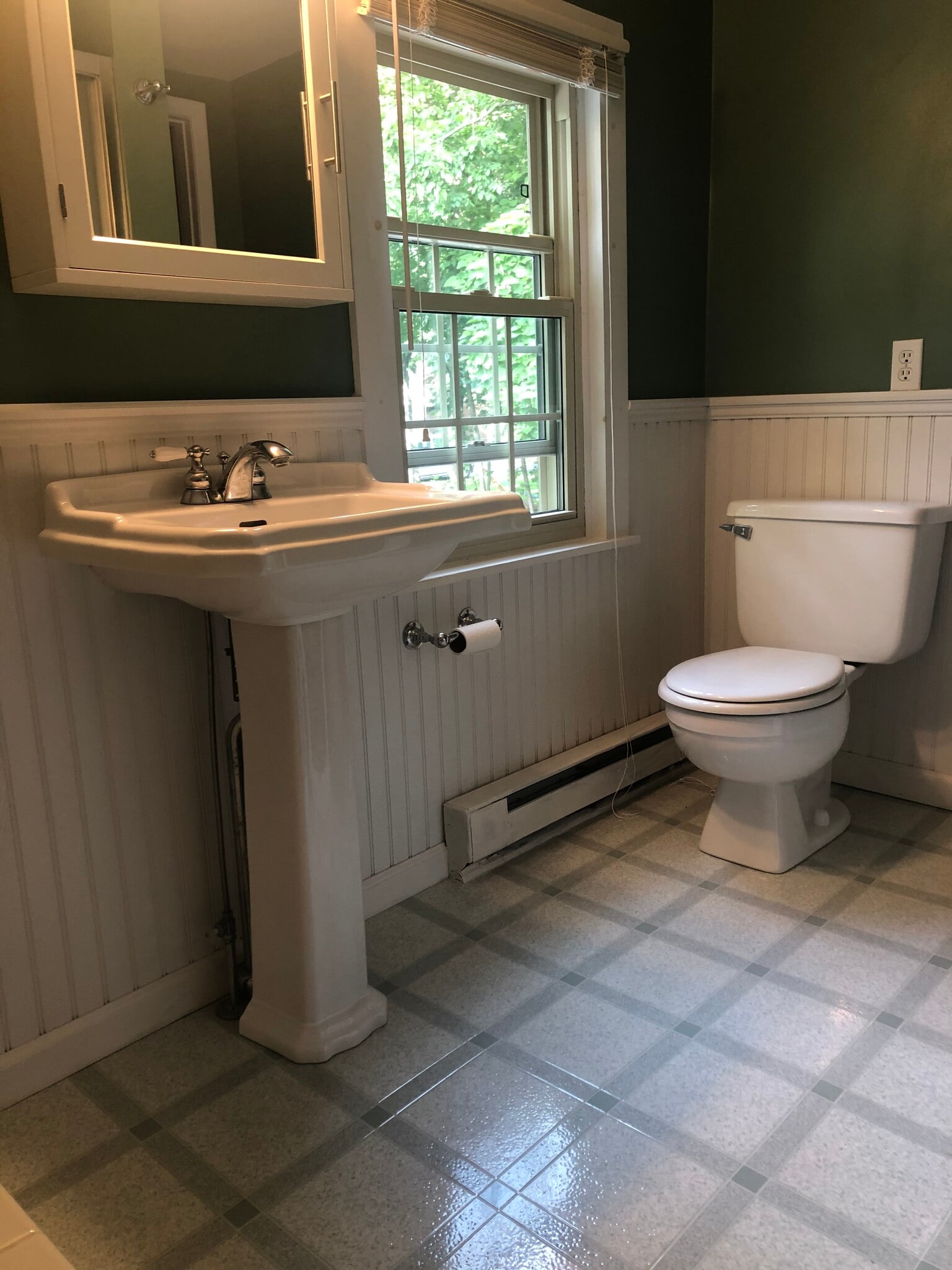 Shared second-floor bathroom with freestanding shower and tub. - 11 Kellogg St