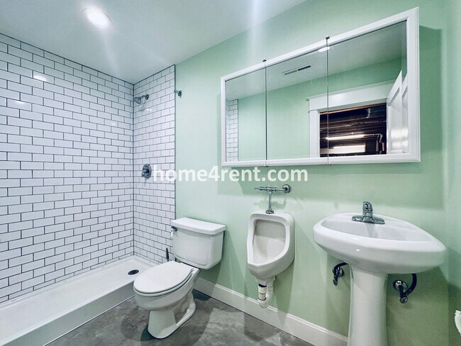 Building Photo - Charming Home Near Country Club Plaza w/ Gorgeous Updates, Wood Floors and a Two Car Garage!